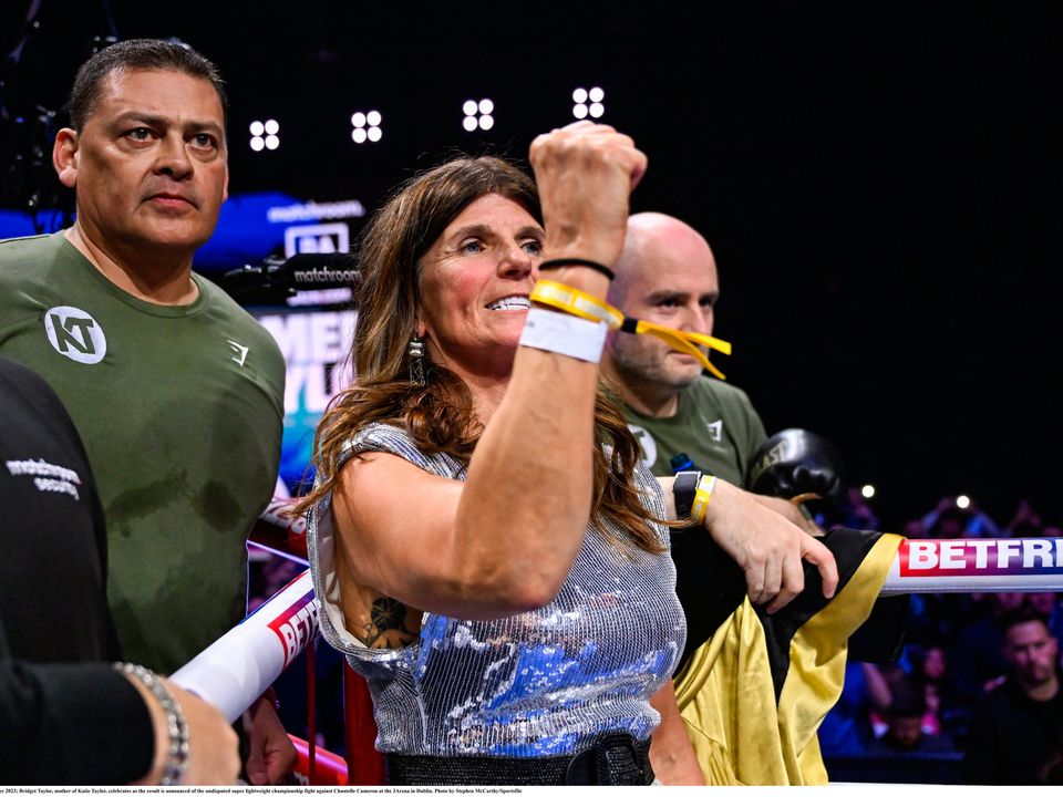 25 November 2023; Bridget Taylor, mother of Katie Taylor, celebrates as the result is announced of the undisputed super lightweight championship fight against Chantelle Cameron at the 3Arena in Dublin. Photo by Stephen McCarthy/Sportsfile