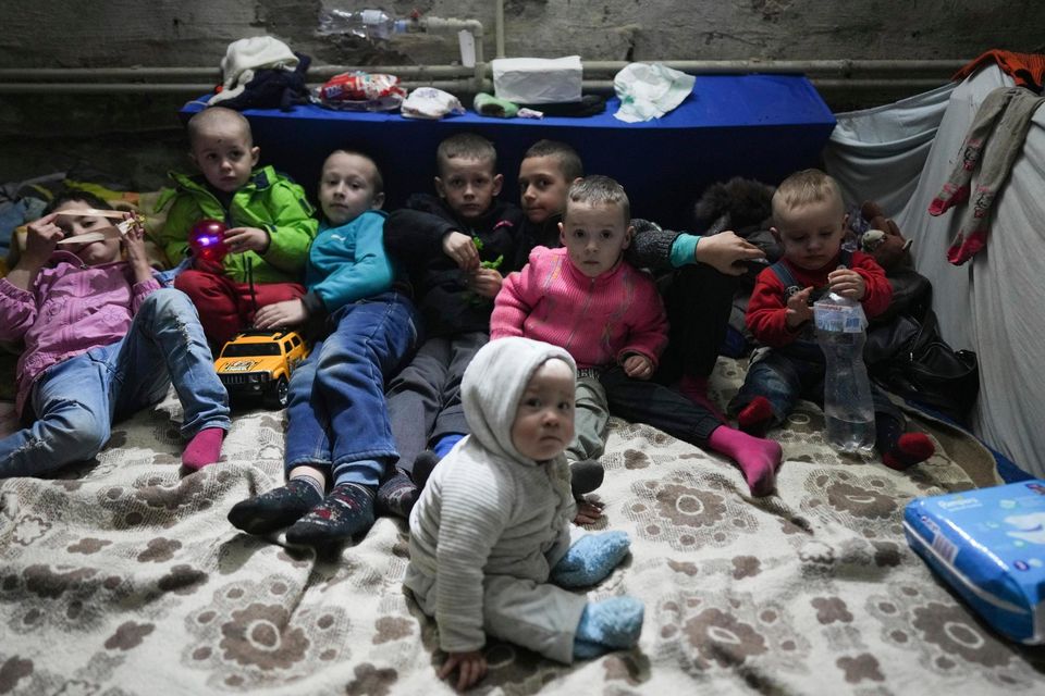 Children seek refuge in a bomb shelter in Mariupol. Picture by Evgeniy Maloletka/AP
