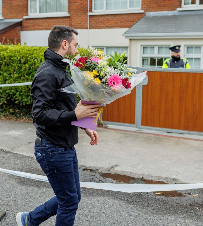 Fine Gael activist Blaine Gaffney arrives with flowers where body was found