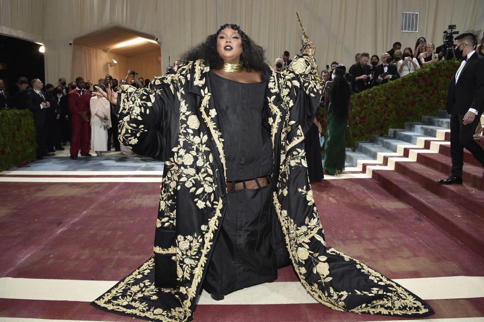 Popstar Lizzo said she felt ‘like a piece of art’ in her outfit for the event – a large black silk, coat with gold bullion decoration created by Thom Browne (Evan Agostini/Invision/AP)