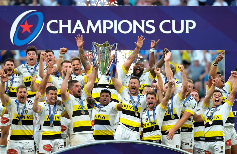 Gregory Alldritt and Romain Sazy of La Rochelle lift the Heineken Champions Cup as their side celebrates after the final whistle. (Photo by David Rogers/Getty Images)
