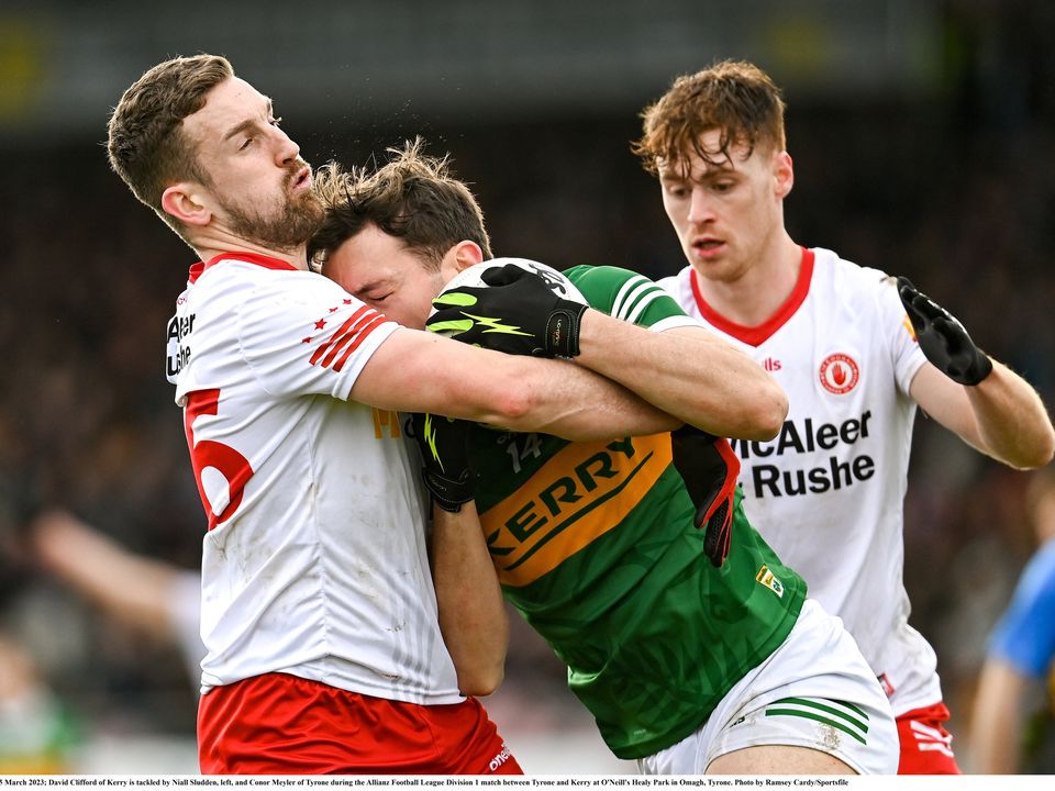 5 March 2023; David Clifford of Kerry is tackled by Niall Sludden, left, and Conor Meyler of Tyrone during the Allianz Football League Division 1 match between Tyrone and Kerry at O'Neill's Healy Park in Omagh, Tyrone. Photo by Ramsey Cardy/Sportsfile