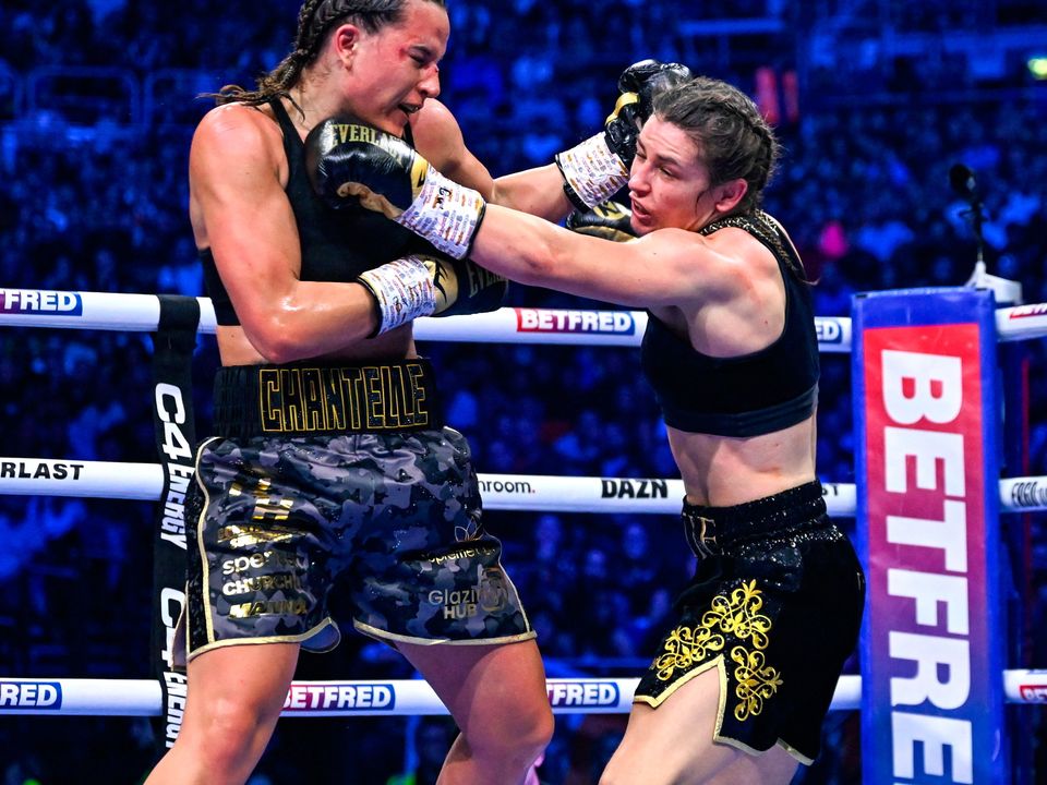25 November 2023; Katie Taylor, right, and Chantelle Cameron during their undisputed super lightweight championship bout at the 3Arena in Dublin. Photo by Stephen McCarthy/Sportsfile