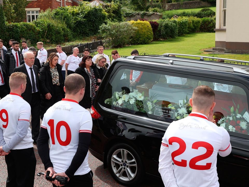 Family members, (left to right) father Sean, sister Louise, mother Susan and sister Catherine, walk through a Guard of Honour as they follow the coffin as it leaves St Patrick's Church, Dungannon, County Tyrone, after the funeral for GAA star Damian Casey, following the death of the Tyrone hurling captain was attending a friend's wedding in Spain when he died in an incident in a swimming pool last week. Picture date: Sunday June 26, 2022. PA Photo. See PA story ULSTER Casey. Photo credit should read: Liam McBurney/PA Wire