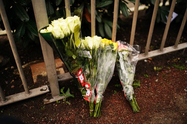 floral tributes left next to a bus stop on Woolwich Church Road in Woolwich, south London