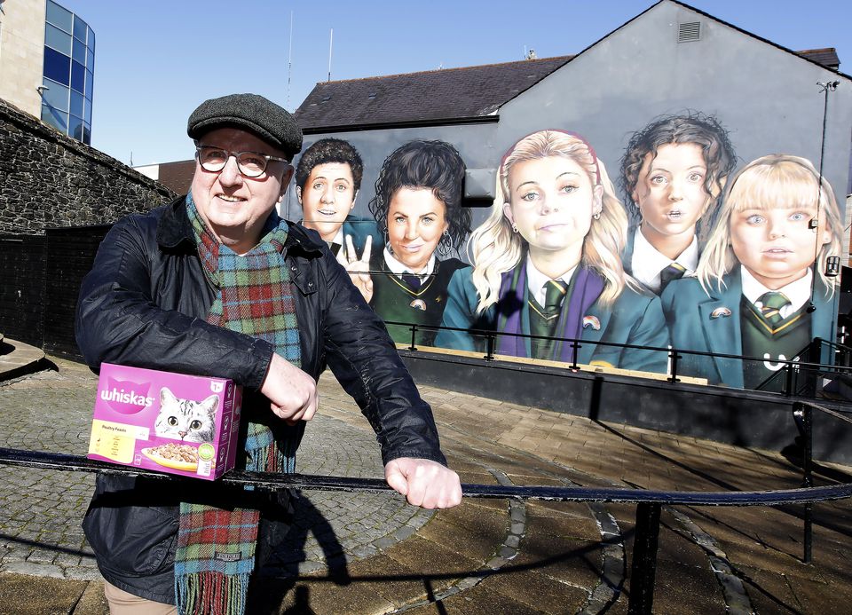 Reporter Hugh Jordan pictured in Derry this week at the Derry Girls mural