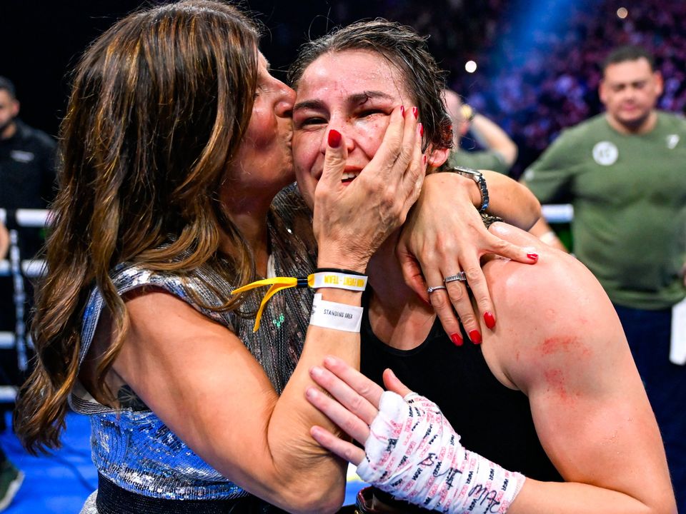 25 November 2023; Katie Taylor celebrates with her mother Bridget Taylor after defeating Chantelle Cameron in their undisputed super lightweight championship fight at the 3Arena in Dublin. Photo by Stephen McCarthy/Sportsfile