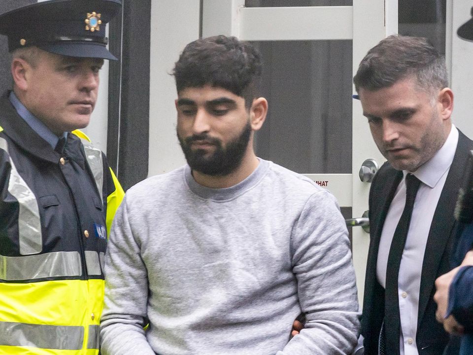 Yousef Palani being brought into Sligo Courthouse last week where he was charged with the murder of two men and assault causing harm to a third. Pic: Donal Hackett.