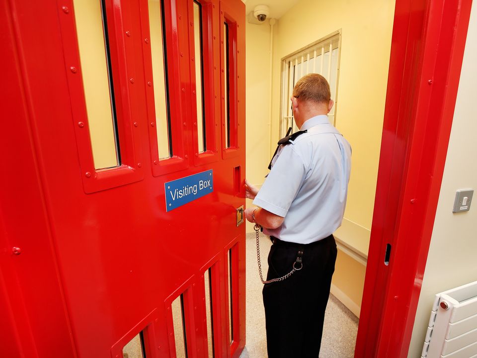 A Prison Officer opens a Visiting Box at the National Violence Reduction Unit