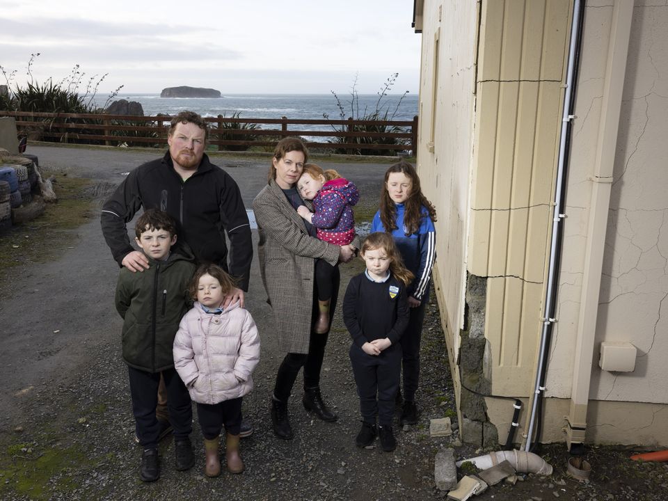 Yvonne and Paul McLaughlin with five of their seven children outside their mica-affected home in  Isle of Doagh, Co Donegal. Photo: Joe Dunne