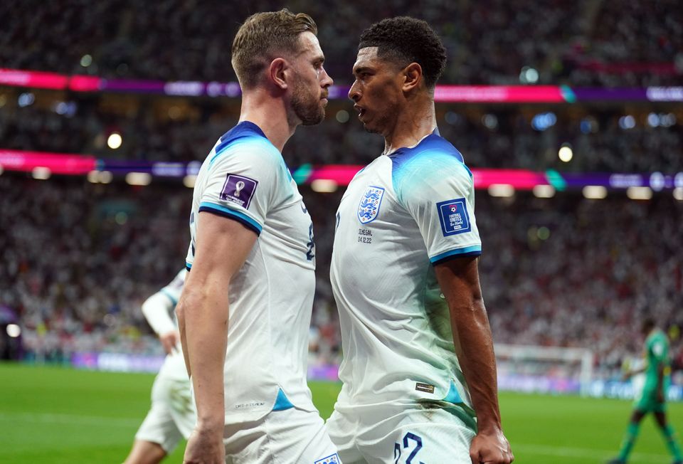 England's Jordan Henderson celebrates scoring the opening goal with Jude Bellingham during the FIFA World Cup Round of Sixteen match at the Al-Bayt Stadium in Al Khor, Qatar. Picture date: Sunday December 4, 2022.