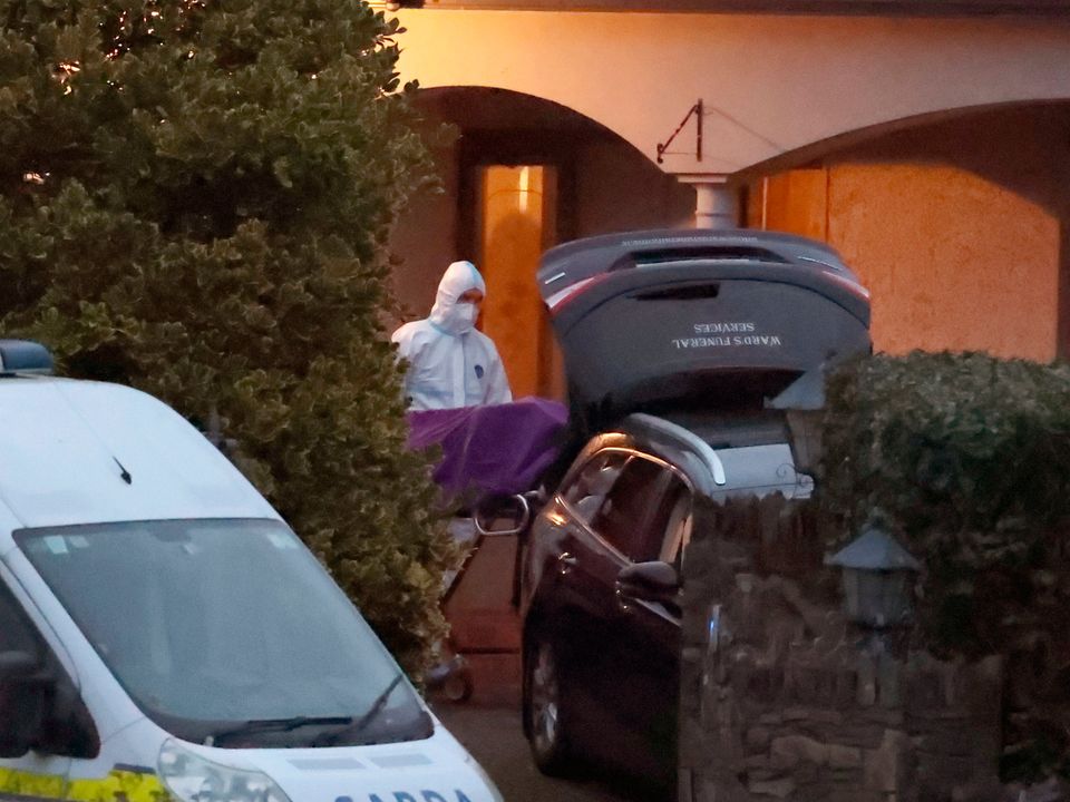 Forensic officers and gardaí at a house in Castleblayney Co Monaghan, where a man's body was discovered. Photo: Liam McBurney
