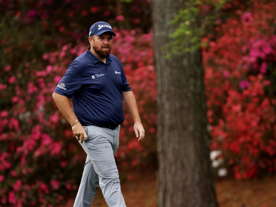 Shane Lowry walks up the 13th fairway during a practice round. Photo: Mike Blake/Reuters