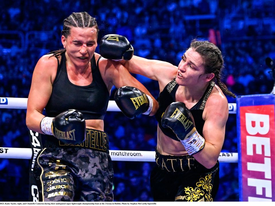 25 November 2023; Katie Taylor, right, and Chantelle Cameron during their undisputed super lightweight championship bout at the 3Arena in Dublin. Photo by Stephen McCarthy/Sportsfile