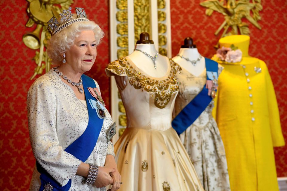 A wax figure of the Queen with some of the outfits (Madame Tussauds/Jonathan Short/PA)