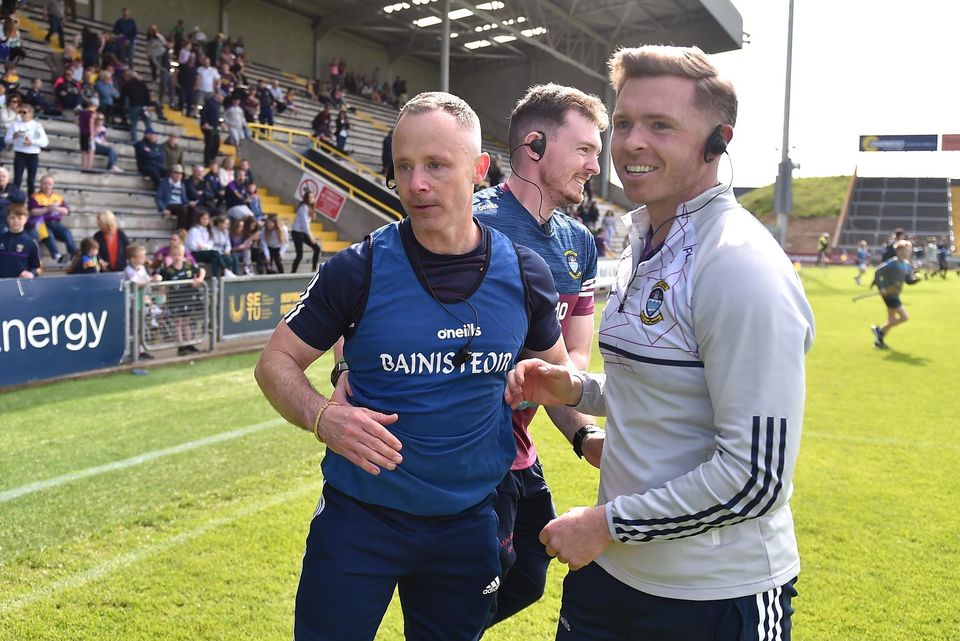 Westmeath manager Joe Fortune (left) and selector Paul O'Donoghue celebrate after the victory over Wexford. Photo: Daire Brennan/Sportsfile