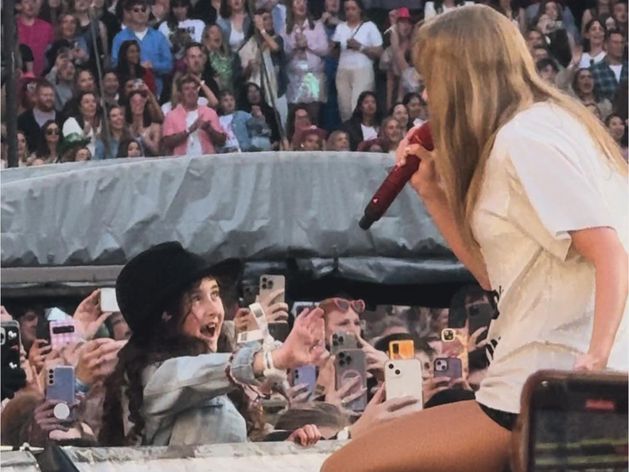 Irish fan (7) in seventh heaven after Taylor Swift gives him her famous hat at a performance