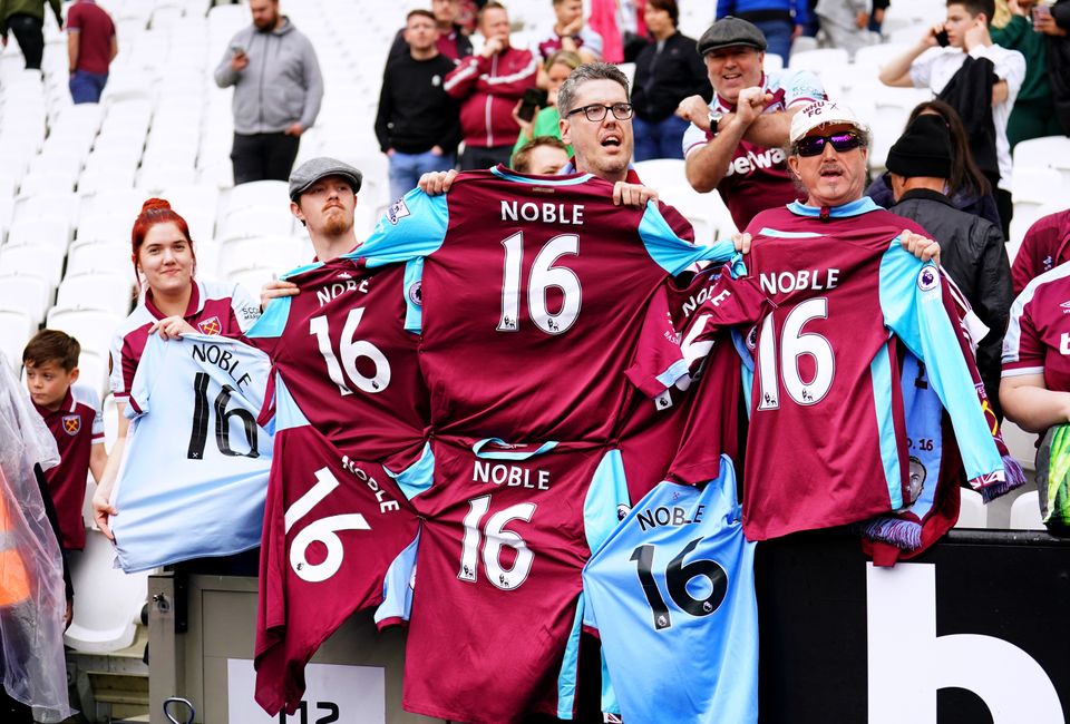 West Ham fans hold up their Mark Noble shirts after a presentation to mark his last home game for the club (Adam Davy/PA)