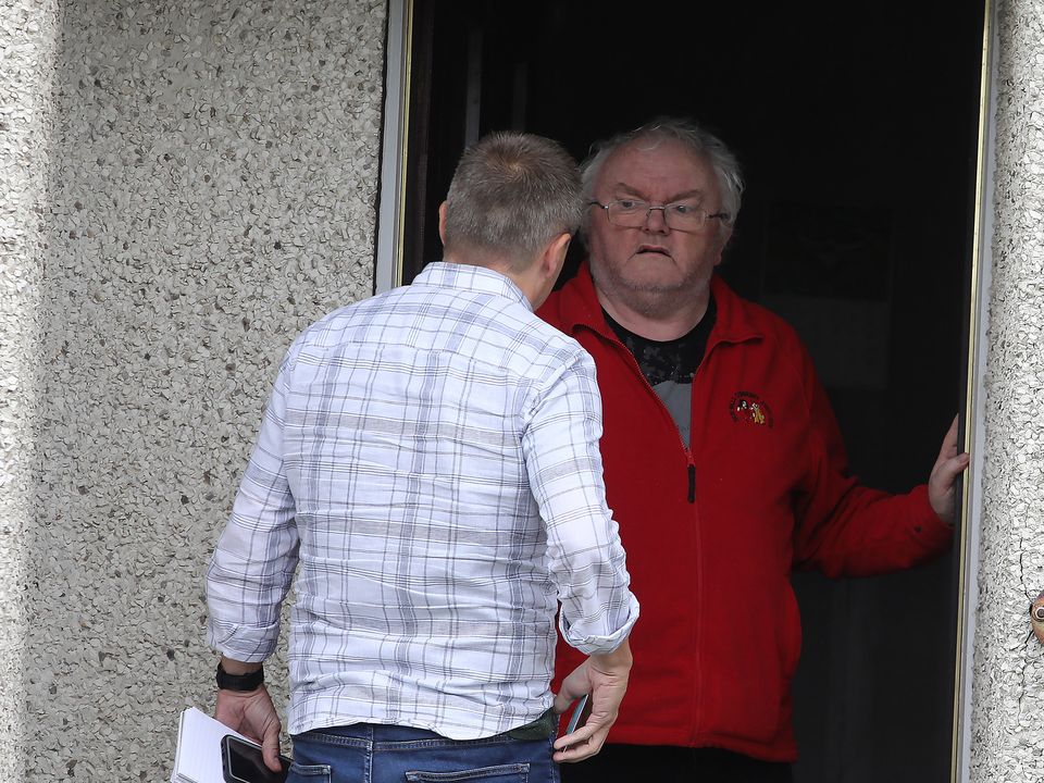 Reporter Steven Moore, comforts former Eucharistic Minister Bernard McNamee, who was recently found guilty of historic sexual abuse of a friends child