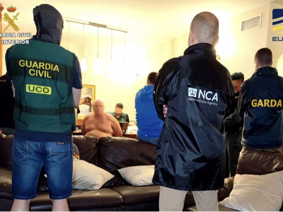 Johnny Morrissey (face blurred) is arrested in Spain. Picture: Guardia Civil