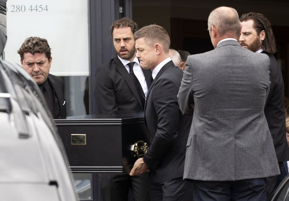 Brian O'Driscoll carries the remains of his father-in-law to the hearse along with his brothers in-law at Massey Bros Funeral Home, Blackrock. Picture Colin Keegan, Collins Dublin