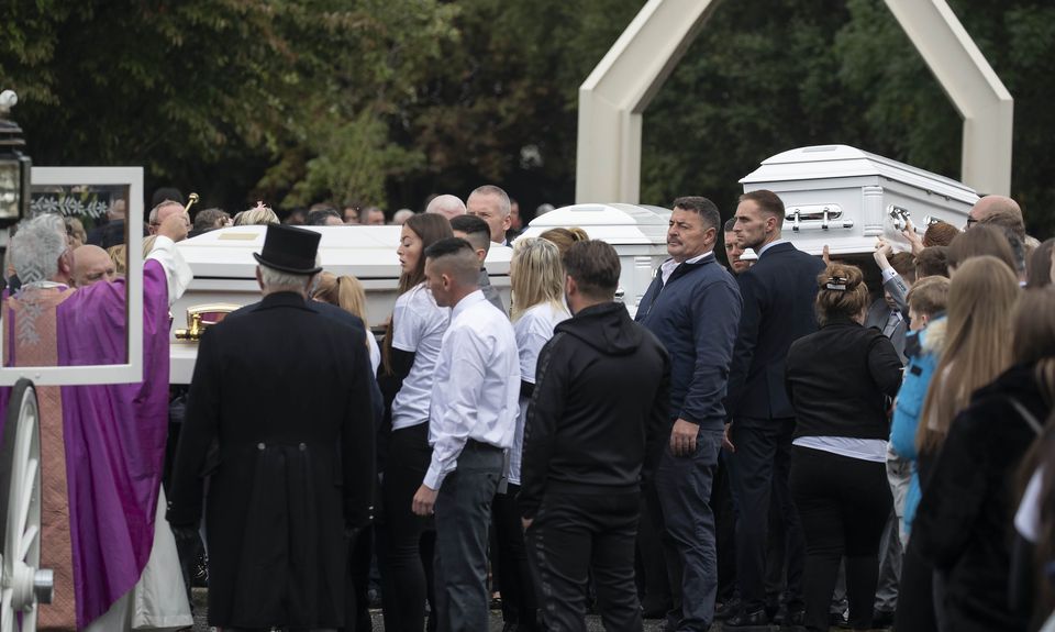 The three white coffins are carried from church after funeral Mass. Photo: Colin Keegan, Collins Dublin