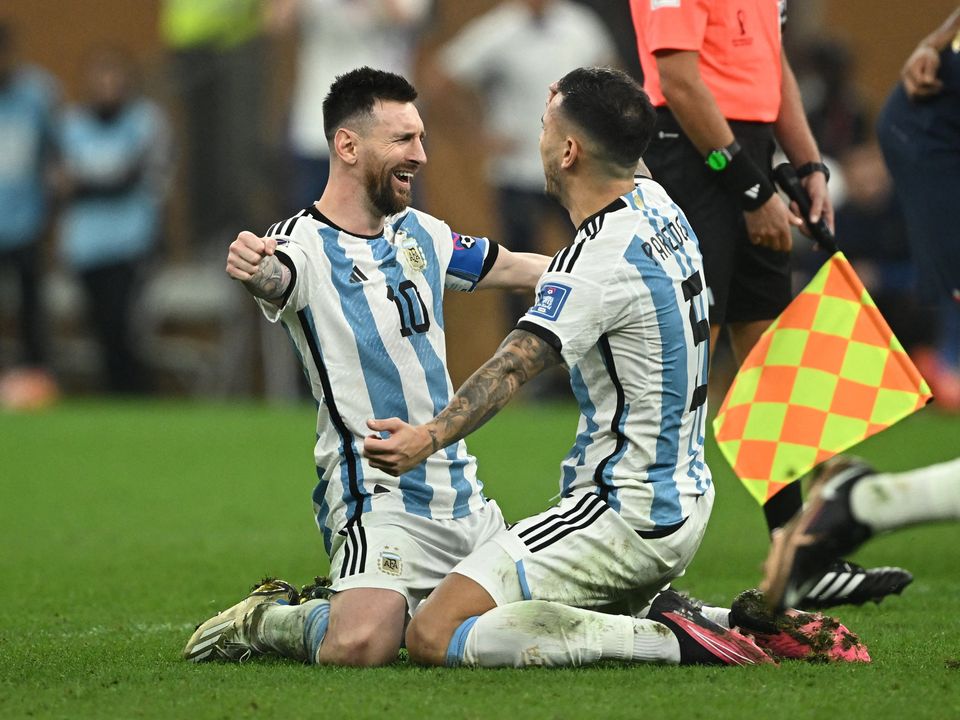 Soccer Football - FIFA World Cup Qatar 2022 - Final - Argentina v France - Lusail Stadium, Lusail, Qatar - December 18, 2022 
Argentina's Lionel Messi celebrates with Leandro Paredes after winning the World Cup REUTERS/Dylan Martinez
