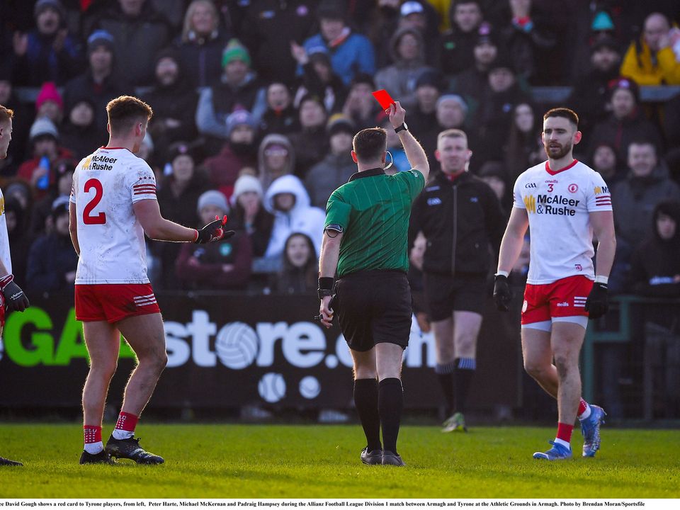 6 February 2022; Referee David Gough shows a red card to Tyrone players, from left,  Peter Harte, Michael McKernan and Padraig Hampsey during the Allianz Football League Division 1 match between Armagh and Tyrone at the Athletic Grounds in Armagh. Photo by Brendan Moran/Sportsfile