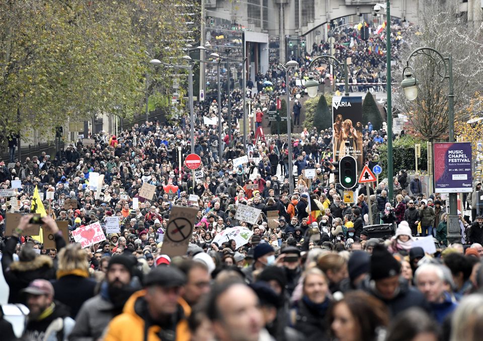 Protesters march against coronavirus measures in Brussels (Geert Vanden Wijngaert/AP)