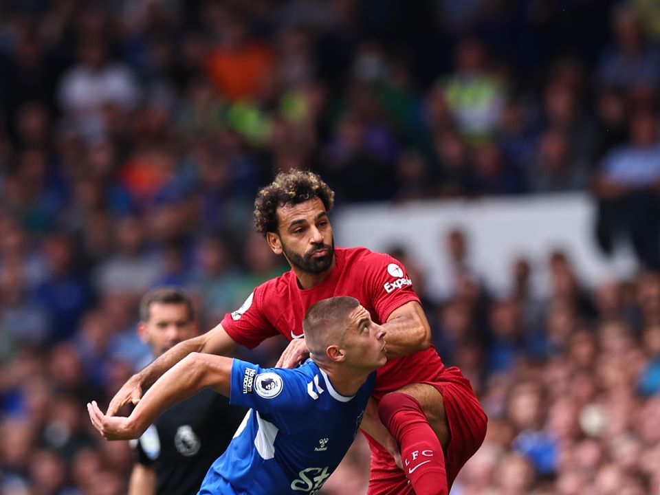 LIVERPOOL, ENGLAND - SEPTEMBER 03: Vitalii Mykolenko of Everton and Mohamed Salah of Liverpool during the Premier League match between Everton FC and Liverpool FC at Goodison Park on September 3, 2022 in Liverpool, United Kingdom. (Photo by Robbie Jay Barratt - AMA/Getty Images)