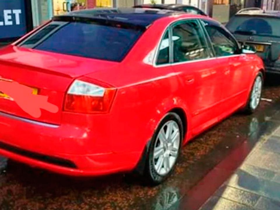 Kelly’s distinctive red Audi car