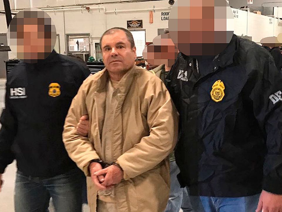 Sinaloa Cartel boss Joaquin Guzman Loera aka "El Chapo" Guzman is escorted by Mexican police as he is extradited to US