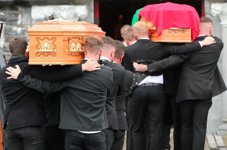 The coffins of Eileen and Jamie O'Sullivan are carried into St Michael's Church in Lixnaw in North County Kerry. Niall Carson/PA Wire
